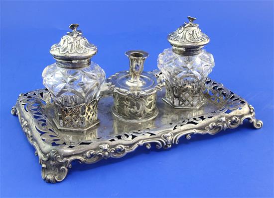 An ornate Victorian pierced silver inkstand, 9.5in., 14.5oz.